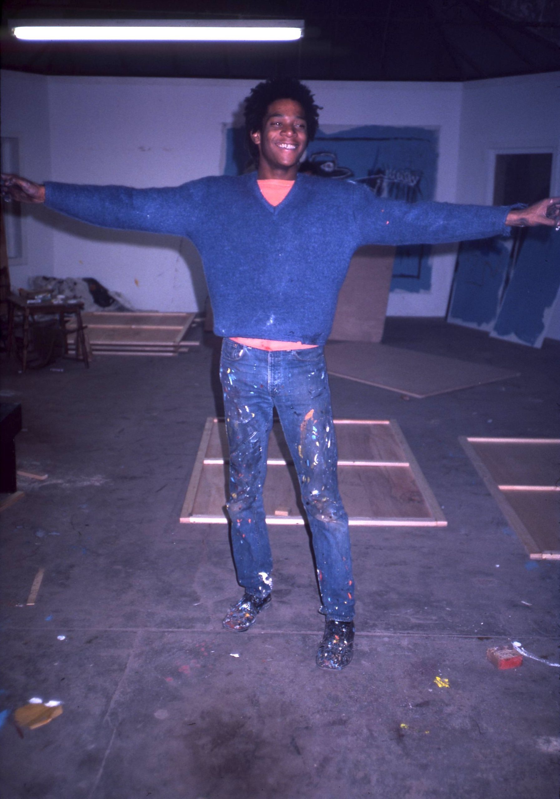 Jean Michel Basquiat in his first studio space, fall 1981.