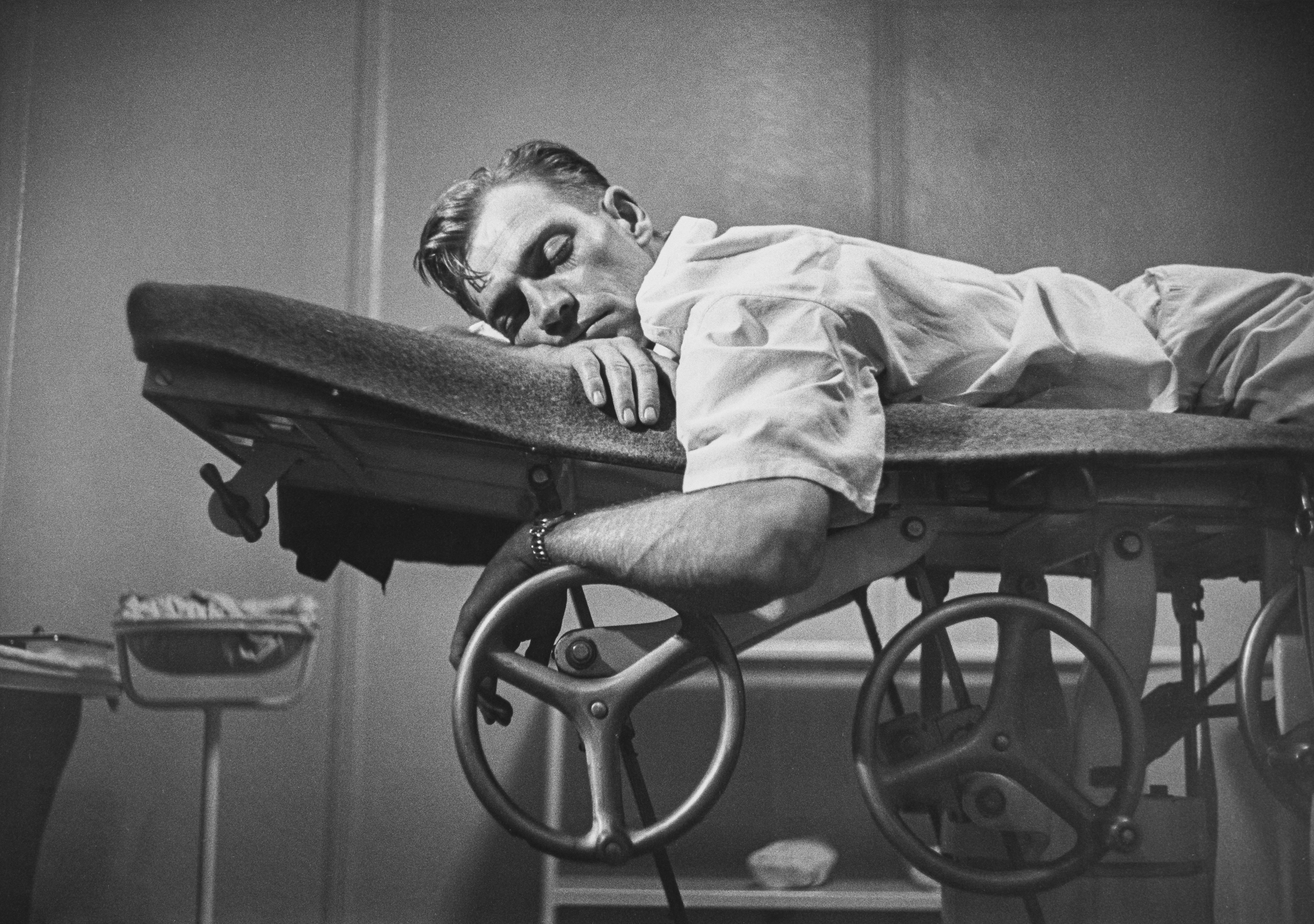Country Doctor - Dr. Ernest Ceriani Sleeping on Examination Table
